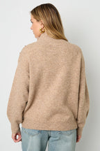Sweater with buttons on the shoulder
