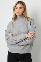 Sweater with buttons on the sleeves