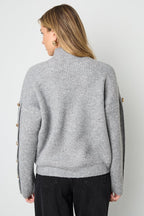 Sweater with buttons on the sleeves