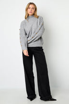 Sweater with buttons on the sleeves